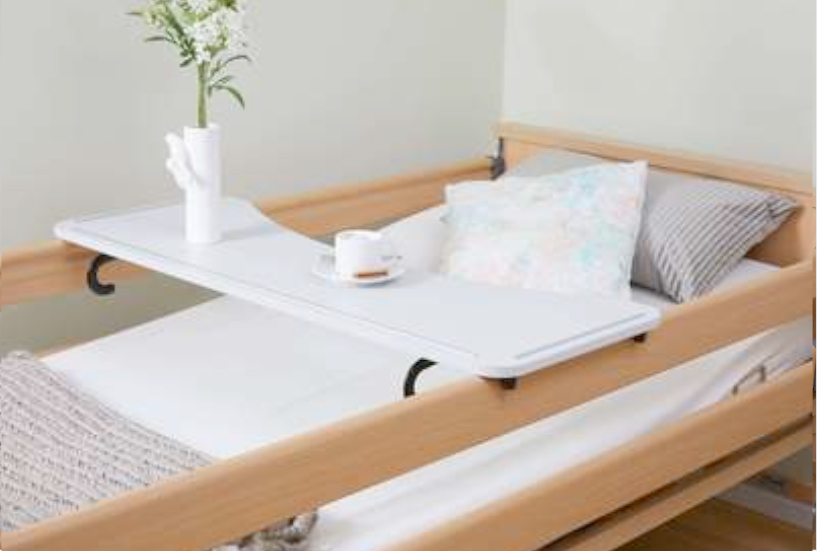 Tray that rests on the raised safety sides